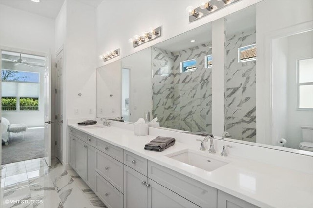 bathroom featuring walk in shower, vanity, and toilet