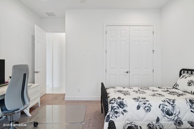 carpeted bedroom with a closet