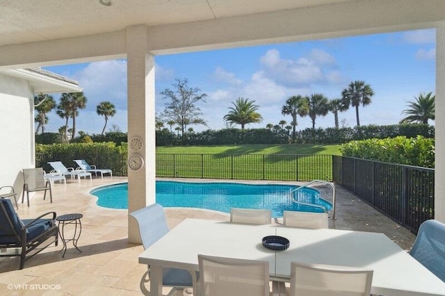 view of swimming pool with a patio area