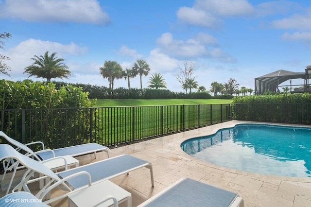 view of pool featuring a yard, a lanai, and a patio area