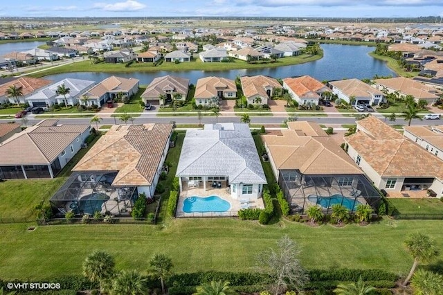 birds eye view of property featuring a water view