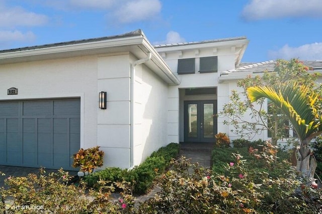 view of exterior entry featuring a garage