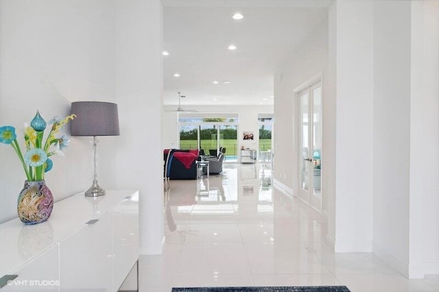 hallway with light tile patterned floors