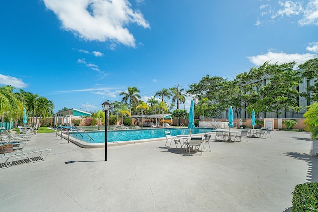 view of swimming pool with a patio area