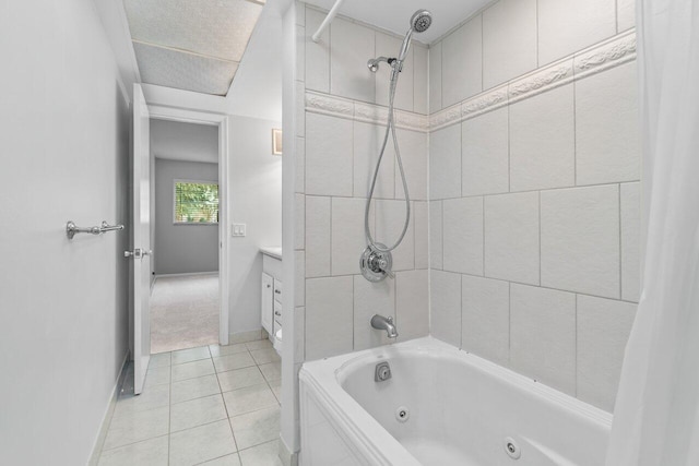 bathroom with vanity, shower / bathtub combination with curtain, and tile patterned floors