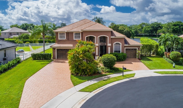 mediterranean / spanish-style home with a garage