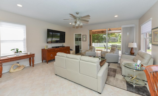 tiled living room featuring ceiling fan