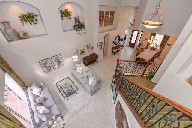 living room with a towering ceiling