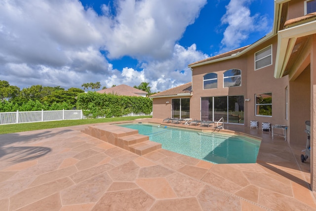 view of swimming pool with a patio area