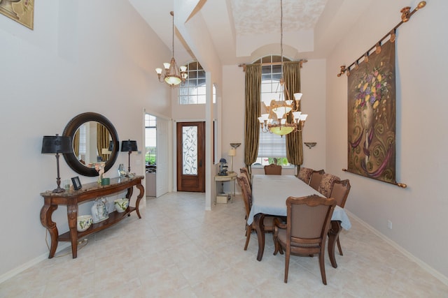 dining area with an inviting chandelier