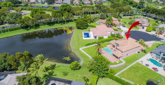 birds eye view of property featuring a water view