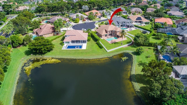 birds eye view of property with a water view