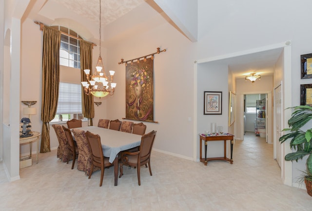 dining area featuring an inviting chandelier