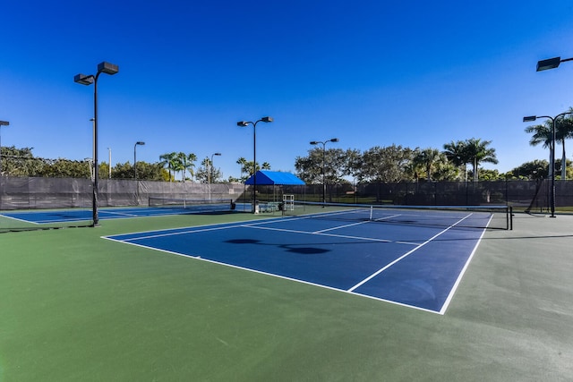 view of sport court with basketball hoop