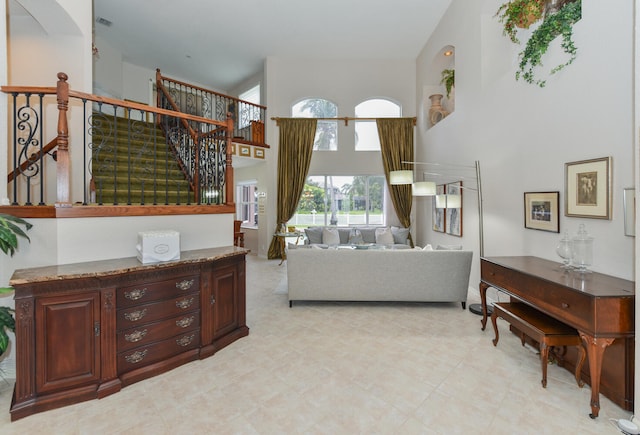 living room featuring high vaulted ceiling