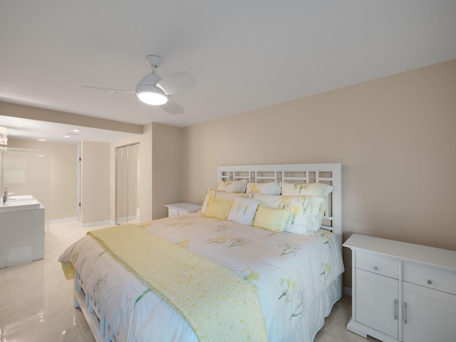 bedroom with ceiling fan and sink