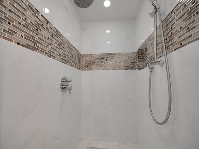 bathroom with a tile shower