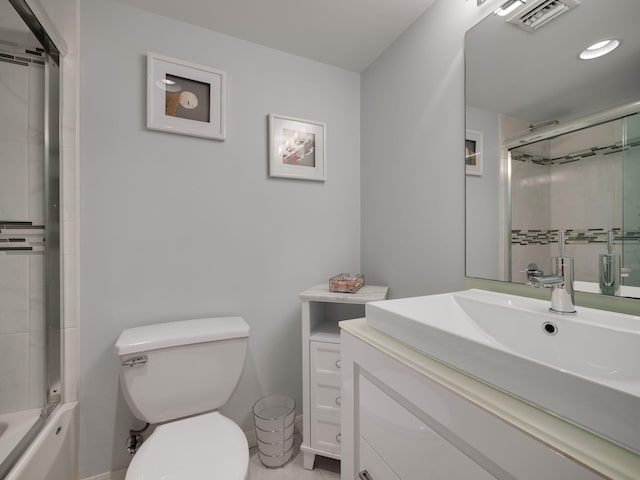 full bathroom with shower / bath combination with glass door, vanity, and toilet