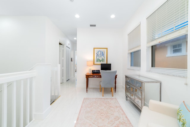 office space featuring recessed lighting, visible vents, and baseboards