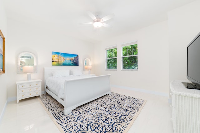 bedroom with baseboards and ceiling fan