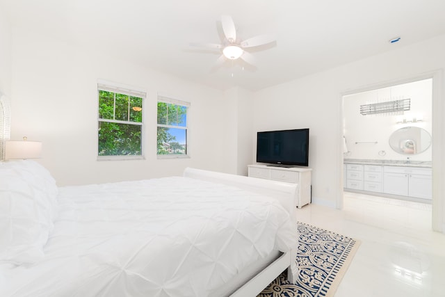 bedroom featuring wet bar, ensuite bath, light tile patterned floors, and ceiling fan