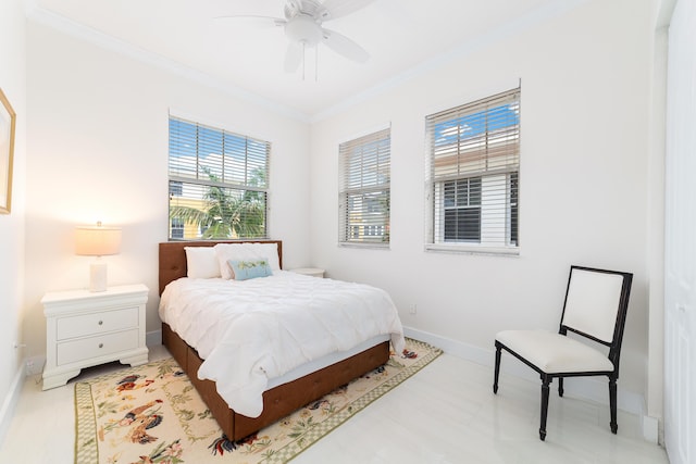 bedroom with baseboards, ceiling fan, and crown molding