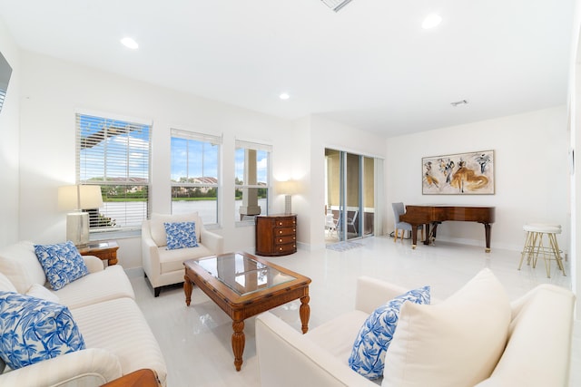 living room with visible vents, recessed lighting, and baseboards