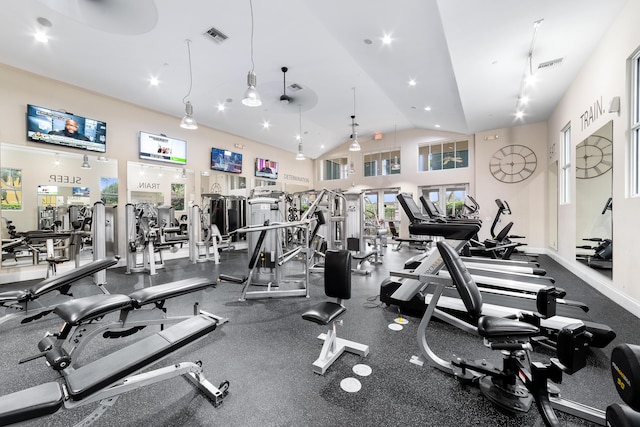 gym featuring recessed lighting, visible vents, baseboards, and high vaulted ceiling