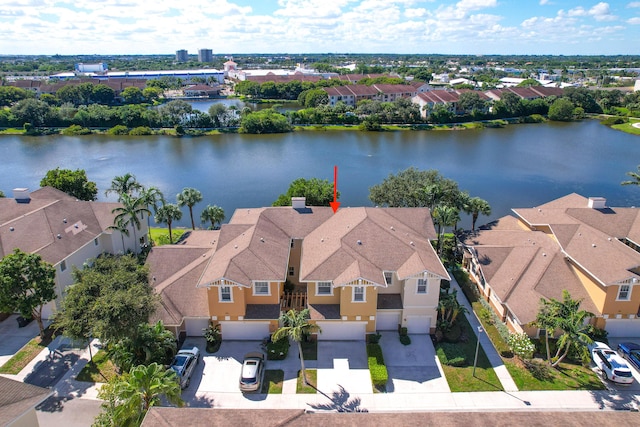 bird's eye view featuring a residential view and a water view