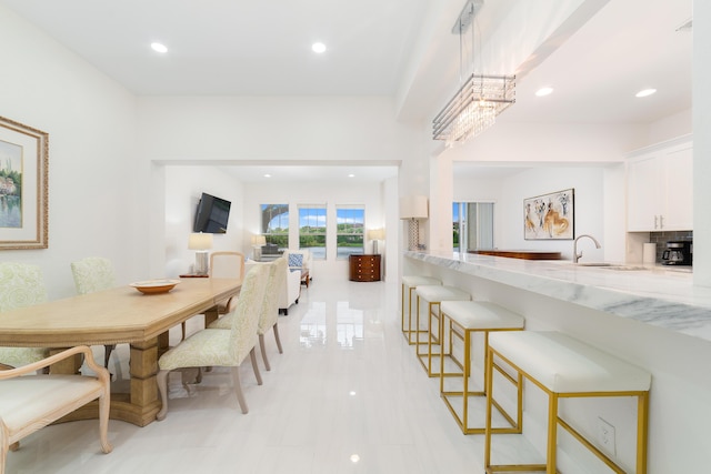 dining space featuring recessed lighting