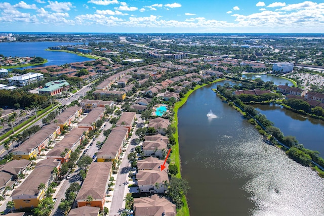 birds eye view of property with a residential view and a water view