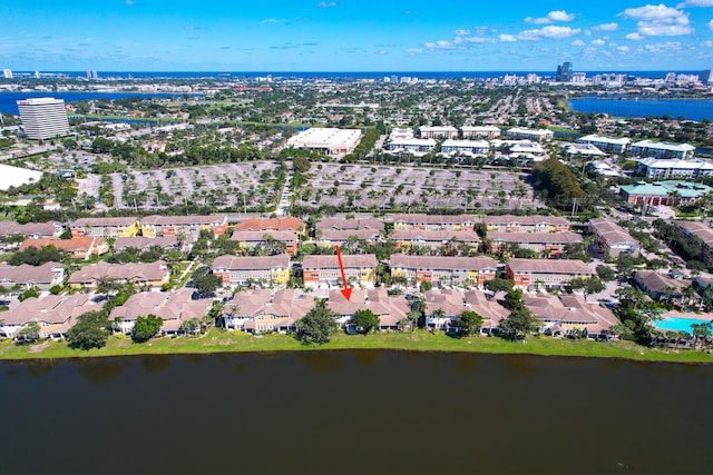 drone / aerial view with a residential view and a water view