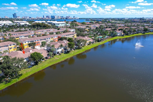 drone / aerial view featuring a view of city and a water view