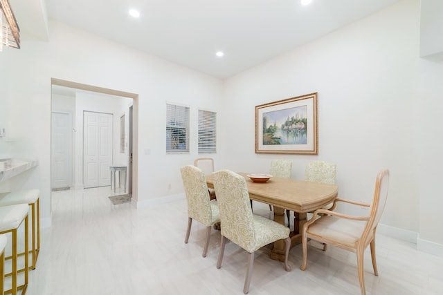 dining space featuring recessed lighting and baseboards