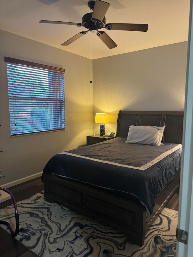 bedroom featuring hardwood / wood-style flooring and ceiling fan