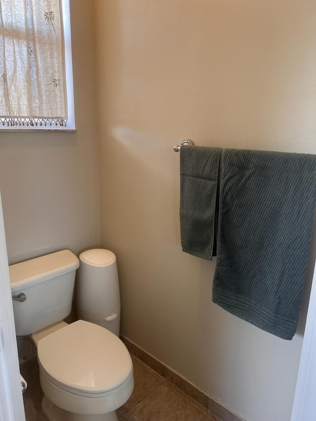 bathroom featuring tile patterned flooring and toilet