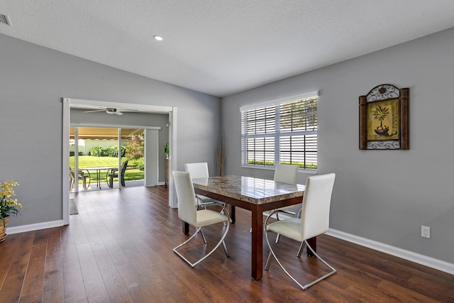 dining space with a textured ceiling, ceiling fan, and a wealth of natural light