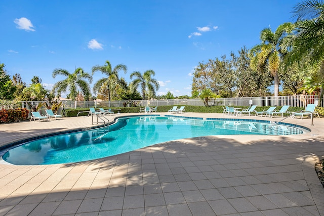 view of swimming pool with a patio