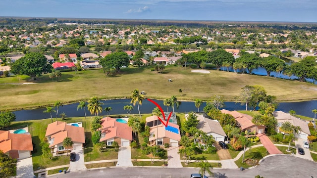 bird's eye view with a water view