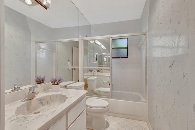 full bathroom featuring toilet, tiled shower / bath, tile patterned flooring, and vanity