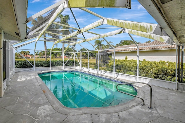 view of pool featuring a lanai and a patio area