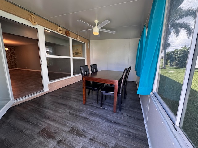 sunroom featuring ceiling fan