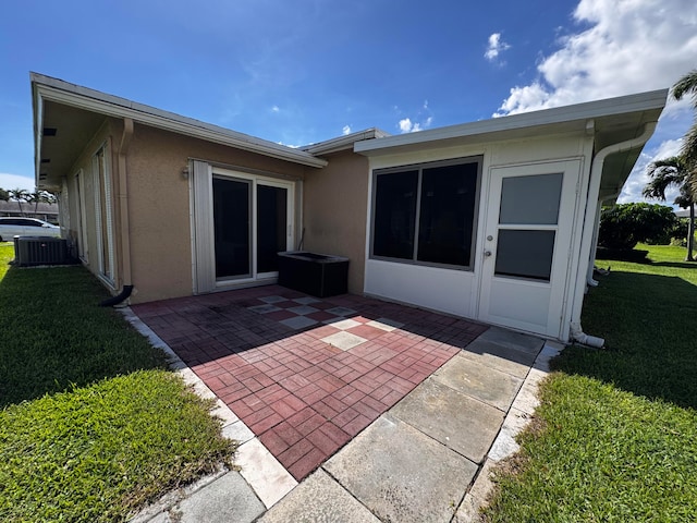 back of house with a patio area, a yard, and cooling unit