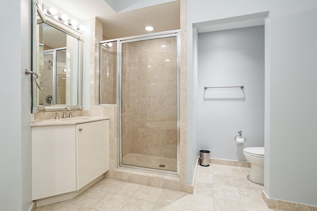 bathroom featuring a shower with door, vanity, toilet, and tile patterned flooring