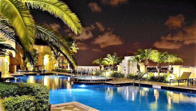 view of pool at night