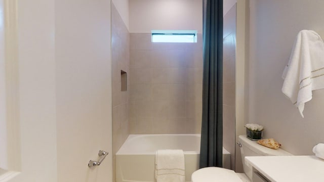 full bathroom with vanity, toilet, and shower / tub combo with curtain