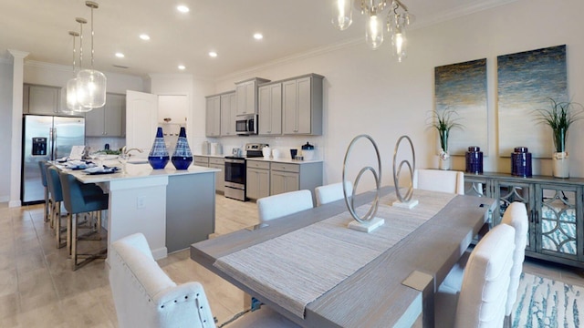 dining area featuring crown molding and a chandelier