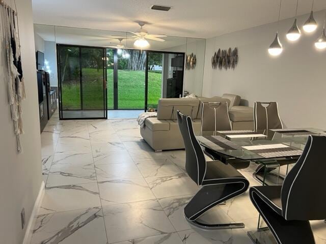 dining area featuring ceiling fan