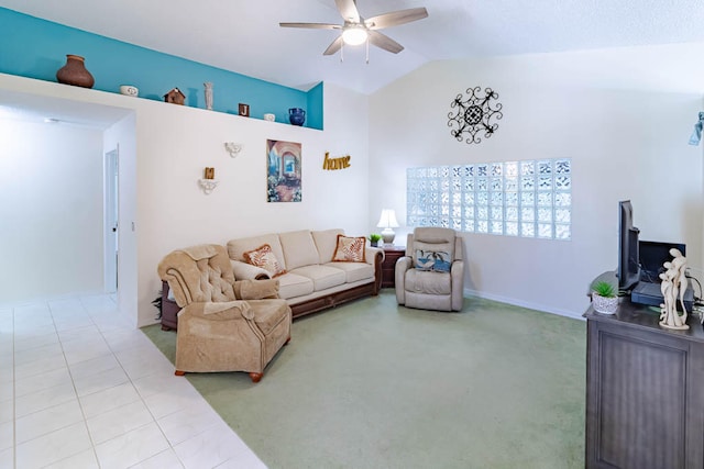 living room featuring vaulted ceiling, ceiling fan, and light tile patterned flooring