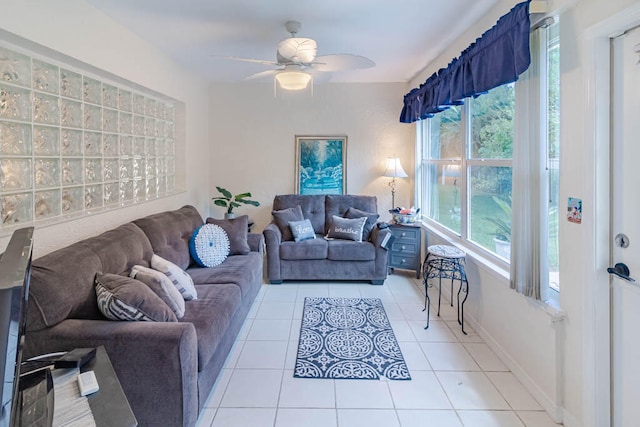tiled living room featuring ceiling fan